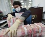 Lavan billetes en China para evitar propagación del coronavirus
