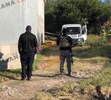 Localizan cadáver de mujer en un lote baldío