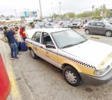 Taxistas amenazan a choferes de Uber y Didi