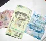 Revisan billetes falsos por temor